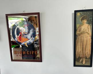 On the left is a Miller High Life Beer bar mirror, and on the right is a damsel fondly expressing "Absence Cannot Hearts Divide".