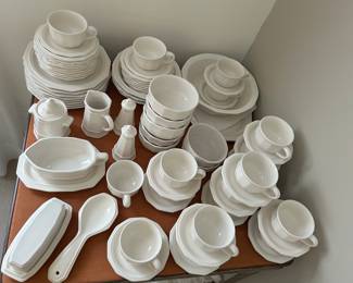 A large quantity of white Pflatzgraf dinnerware with platters, large bowls, salt & pepper, sugar & creamer, and other serving dishes.