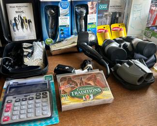 NIB- Hair clippers, NIB electric razors, appear to be unusedbinoculars (10x25 & 10x50).