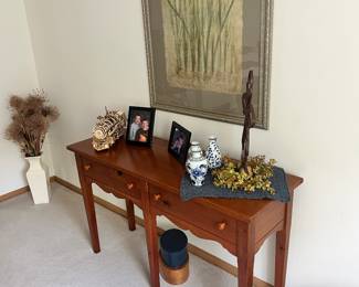 2 drawer side table with an example of the artwork for sale.
