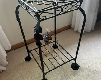Black wrought iron planter stand.