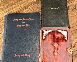 On the left is a 1942 Song and Service Book for Ship and Field for the Army and Navy. On the right you have an 1800s German Bible and a 1901 German hymnal.