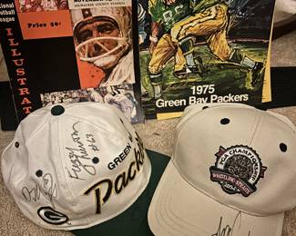 The Packer hat has Lynn Dickey, Fuzzy Thurston and Derek Mayes autographs. The 2004 Whistling Straits golfinghat has Angel Cabrera autograph. In the back you’ve got the 1965 Green Bay Packers VS the LA Rams Program and a 1975 photo book where there’s 11of the 15 photos.