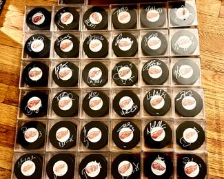LOTS of Red Wings signed pucks...all from the 2007/08 era