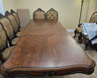 This very long formal dining room table set is leftover from last week's sale which is in Viera. On Crane Creek boulevard. In the development 6 Mile Creek. Mint condition I just thought it deserved another shot at trying to sell there are three leaves in it and six very nice chairs with two Captain chairs please do not come to this sale looking for this set if you want to see it just text me 321-223-3689 and I can give you access to that house it is $1,000 for the whole dining room set beautiful.