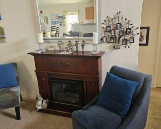 Here is a farther away picture of the fireplace that uses canned fuel which we have in a box. $250 includes the fuel