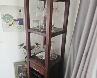 Over 6 ft tall wooden wine cabinet that holds bottles, glasses and a drawer for holding wine tools $100