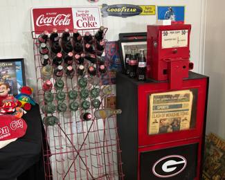 Vintage Coca Cola Bottle Rack Bottle Display "Things Go Better with Coke" | Vintage Georgia Bulldogs Newspaper Vending Machine | Assorted Advertising Signs Greyhound, Goodyear