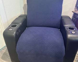#56 - $400 - Black leather theater recliner with all kind of gadgets & lights effect. Client kept the protective cover on. (approx 2 years old) Mint condition