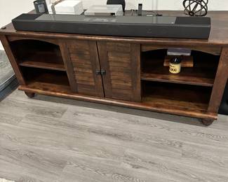 #9 - $350 - Brown TV cabinet with shutters doors 26x63x21