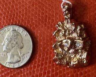 #F -$400 - 10kt gold nugget. w/3 diam 1.25"H -10.98gr