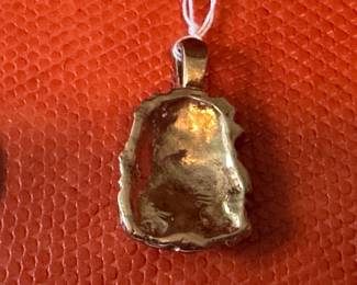 #F -$400 - 10kt gold nugget. w/3 diam 1.25"H -10.98gr