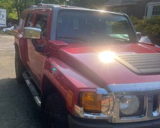 Two red H3 Hummers in excellent condition. $5,500 each.