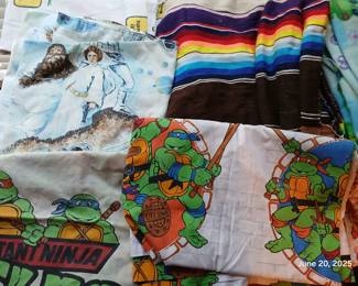 Teenage mutant ninja turtles and star wars bedding.