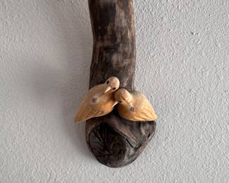 Little carved birds on a branch