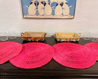 Colorful vintage round raffia placemats and casserole holders and wine glasses