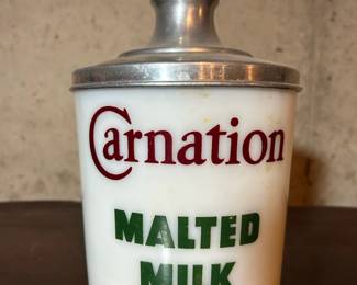 Unique Carnation canister with original top.