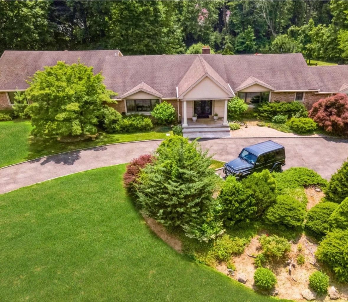 Large home filled with beautiful furnishings including antiques
