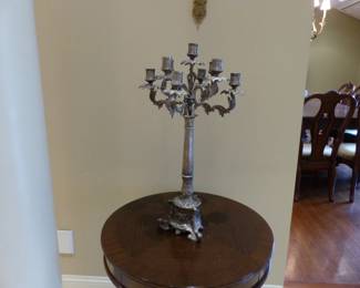 Pair of small round tables, pair of candelabras