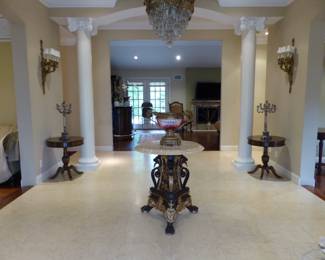 Stunning marble top entrance table, bronze chandelier, pair of bronze sconces, pair of small round tables, pair of candelabras
