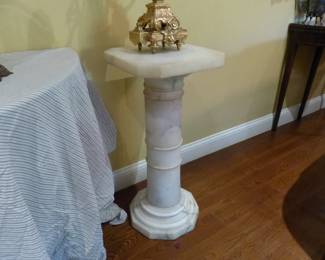 Pair of bronze candelabras, pair of marble pedestals