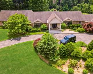 Large home filled with beautiful furnishings including antiques