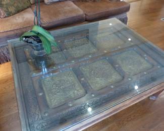 Coffee table with ornate brass inserts