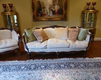 Carved mahogany sofa with matching accent chair, pair of gold leaf hand painted vitrines, framed artwork, bric-a-brac, large area rug