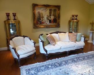 Carved mahogany sofa with matching accent chair, pair of gold leaf hand painted vitrines, framed artwork, bric-a-brac, large area rug