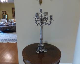 Pair of small round tables, pair of candelabras
