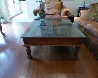 Coffee table with ornate brass inserts