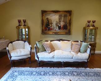Carved mahogany sofa with matching accent chair, pair of gold leaf hand painted vitrines, framed artwork, bric-a-brac, large area rug