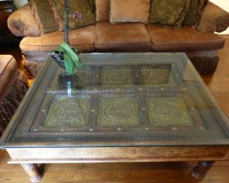 Coffee table with ornate brass inserts