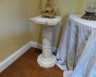 Pair of bronze candelabras, pair of marble pedestals