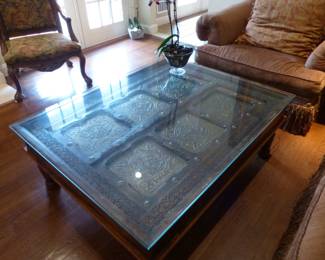 Coffee table with ornate brass inserts