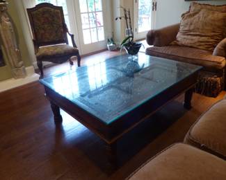 Coffee table with ornate brass inserts