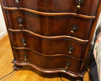 One of two matching serpentine front small chests ( now used as nightstands)