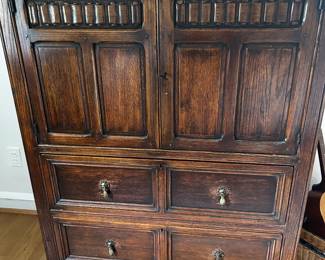 Coninental style carved front oak chest of drawerswith storage drawers behind double doors