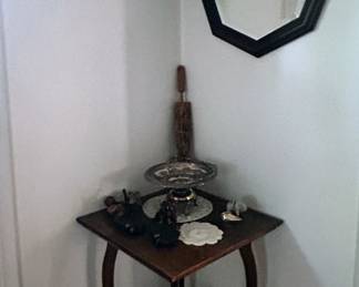 Oak entry table, many vintage prints and accent mirrors throughout the home.