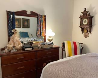 Quilt rack, antique clock and textiles