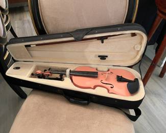 Child's pink violin with case