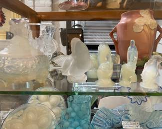 In big showcase you will find, Sabina, Lalique, Roseville and vintage glass pieces