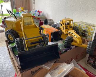 Vintage metal trucks and farming equipment