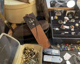 More items, cuff links and tie pins, pocket knives, pins and in the round cellulite box is a cellulite hoop skirt!