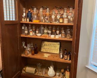 Antique English Wardrobe/Storage cupboard with glass panels at the top of each door. The most glorious collection of Apothecary items I have ever seen!