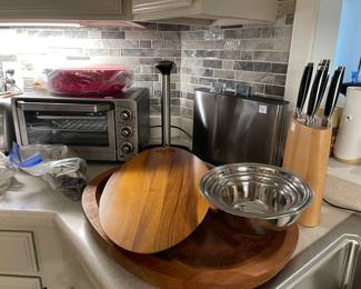 Wonderful wood carving boards, Jamie Oliver knife set, stainless steel bowls, stainless steel individual food types chopping boards, Cuisinart toaster oven
