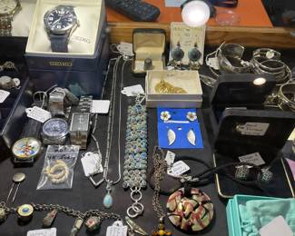Looking into the large showcase, sterling, vintage and costume jewelry