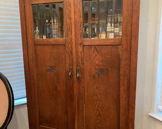 Antique English wardrobe/storage cupboard with glass panels and nice carved details