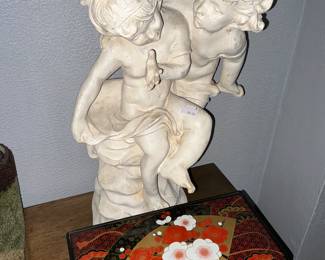 Pair of ceramic children, statue