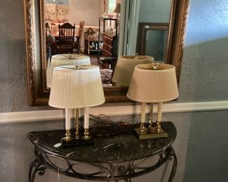 Look like a match but not. One lamp has black marble base other brass